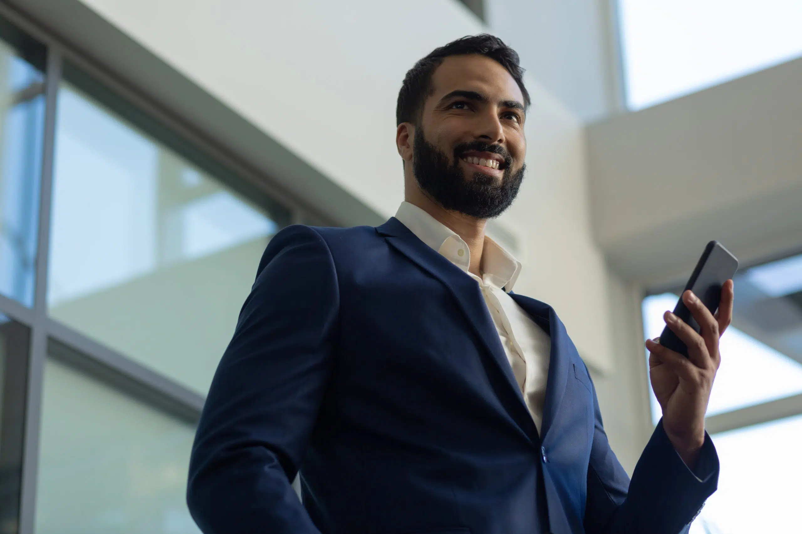 Delighted young office worker expressing positivity while arriving on business meeting